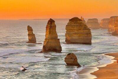 Great Ocean Road Full-Day Sunset Eco Tour from Melbourne - Getting out of Melbourne: Westgate Bridge views, Geelong, and Surf Coast energy